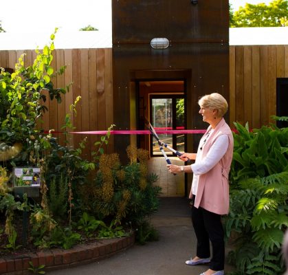 LandAid Chairman Liz Peace cutting the ribbon at Roots and Shoots Environmental Learning Centre