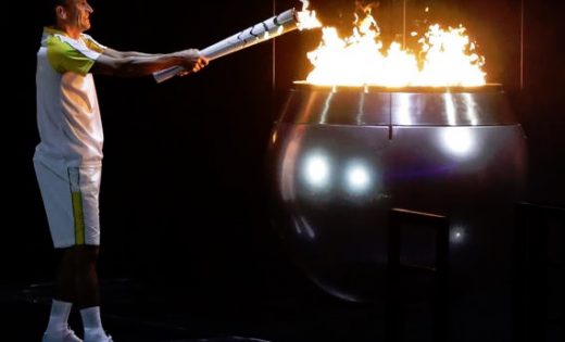 Vanderlei de Lima lights the Olympic flame