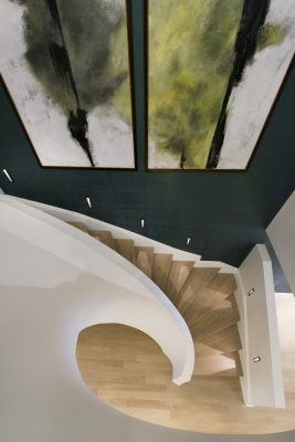 The Park Crescent by Amazon Property curved staircase with artwork