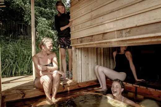 Floating wilderness sauna female bathing students in Soomaa