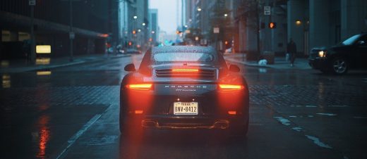 Car Tail Lights Porsche 911 vehicle in rain city