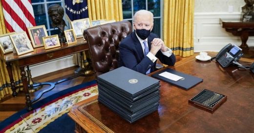 President Joe Biden at the Resolute Desk in his Oval Office at the West Wing of the White House