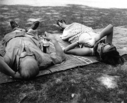 Le Corbusier and Jane Drew lying on a rug