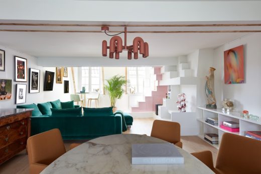 Sun Dial Apartment Paris Interior 

The living space features a play of colourful relief and volumes that form the staircase and fireplace. An indoor planting cascades down a mezzanine wall underlining the importance of nature and its rhythms.

<a href=