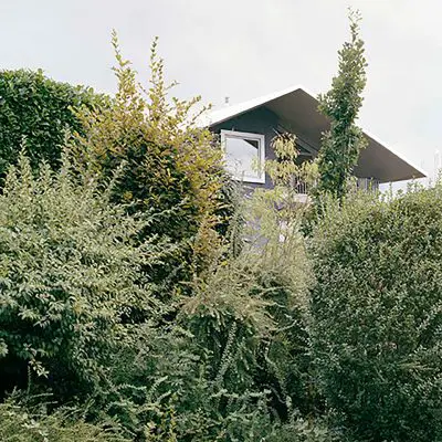 House on a Slope in Switzerland by Karamuk Kuo