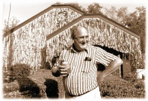 John Milkovisch in front of his home, The Beer Can House