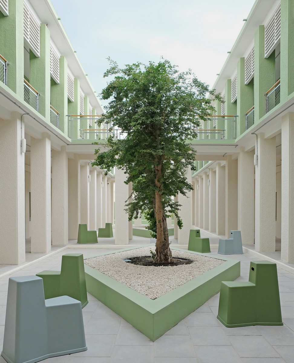 Liwan building courtyard chairs Design Doha Qatar biennial