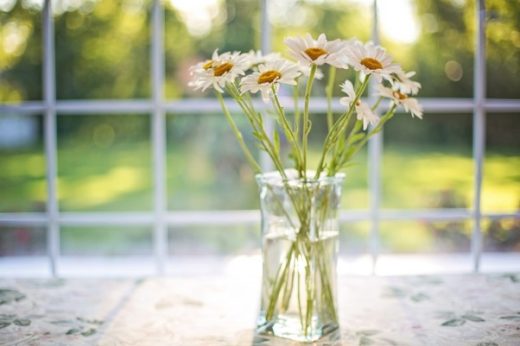 Flowers in a glass vase. Too much heat and they’ll prematurely wilt