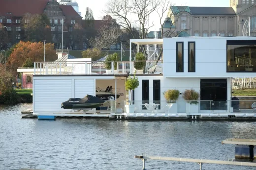 Sustainable Passivhaus house on water with boat