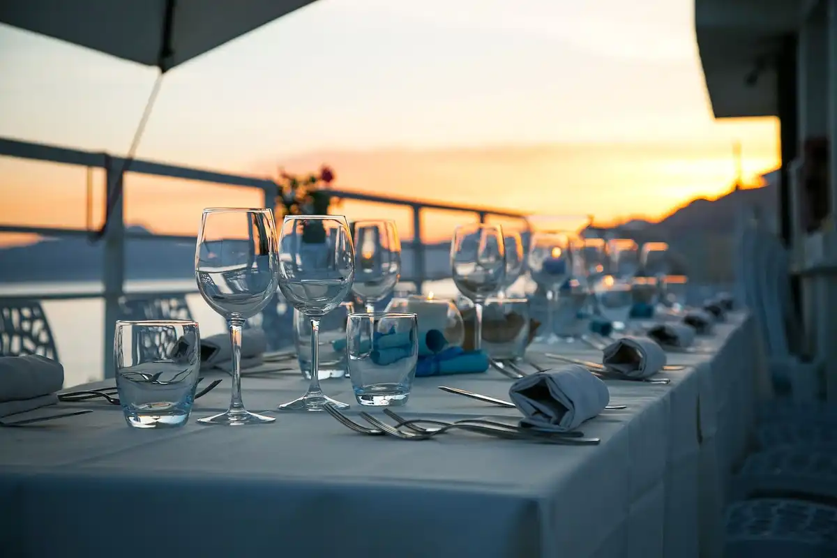 Restaurant table furniture glasses cutlery tablecloth