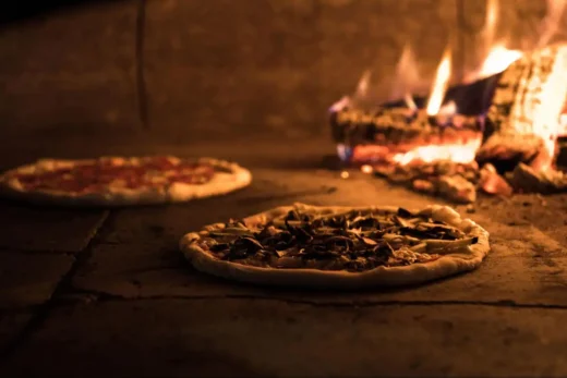 a group of friends enjoying pizza at home