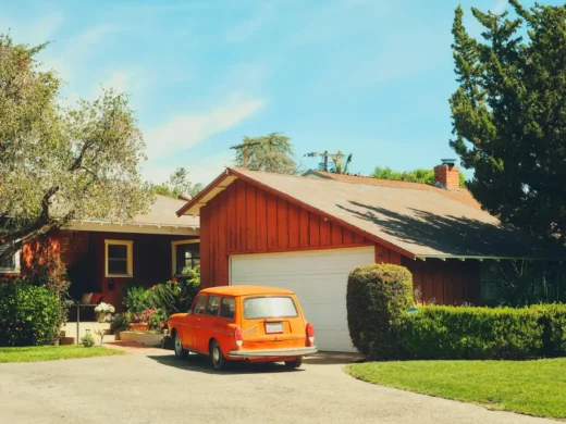 Orange car at hoem agarage - Reduce Car Expenses Without Compromising Safety