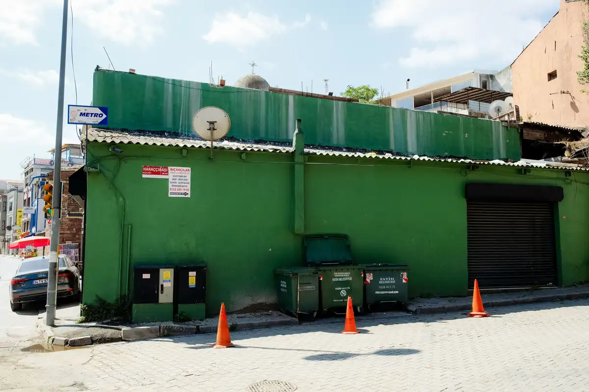 green outdoor dumpster trash disposal