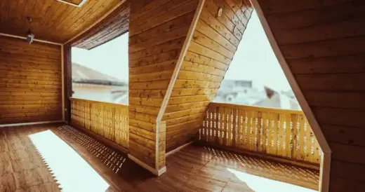 Exposed heavy timber post-and-beam framing showing grain and joinery